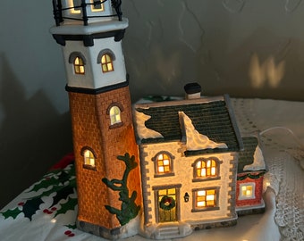 Cape May lighthouse is available Christmas Village from Santas Workbench Collection dated 2000.