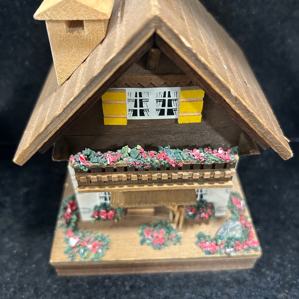 Switzerland style wooden chalet music box which plays “Edelweiss”.Inner workings are Reuge and a Swiss product,Great gift.Plays beautifully