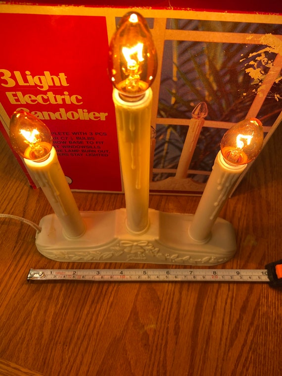 Three light electric candolier in box.