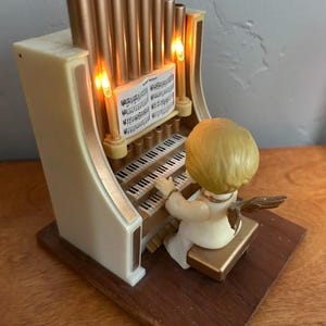 Vintage 1983 Merillite Christmas angel at organ musician plays“Silent Night”. Made in Hong Kong. Needs one 9 volt battery
