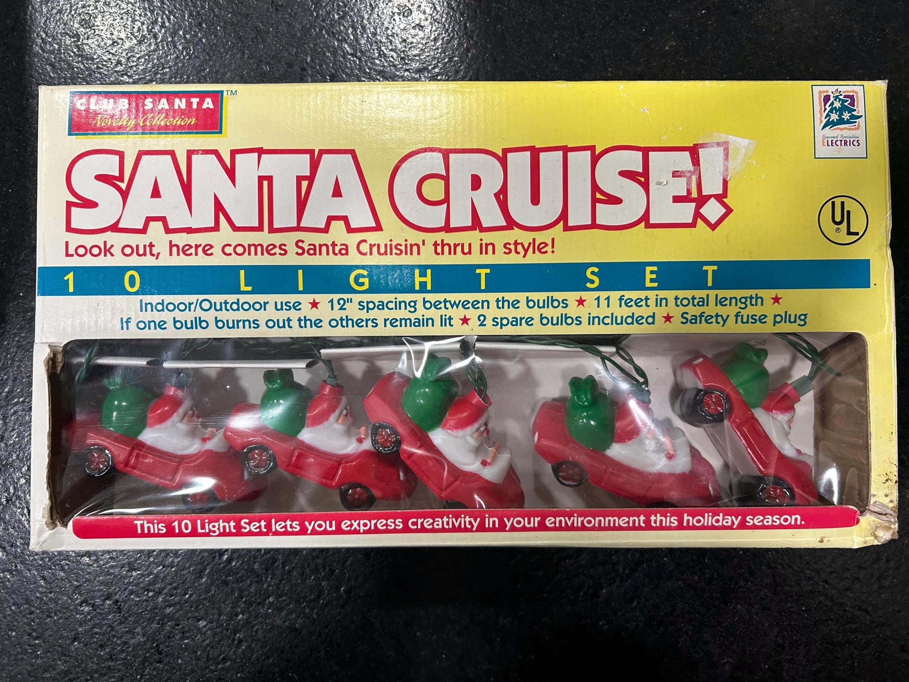 Vintage 1995 santa cruising string Christmas lights.Ten santas in cars and eleven feet of lights spaced apart aprox every foot.Still in box