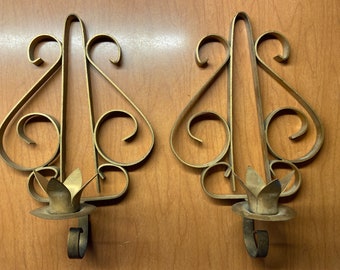 Wall sconces/gold colored pair of single candles metal sconces with scrolling