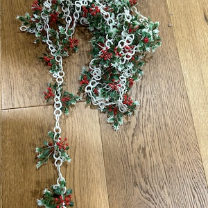 MCM Christmas plastic white chain garland with green white edged holly placed aprox every 3”.total length aprox 11 1/2 feet.