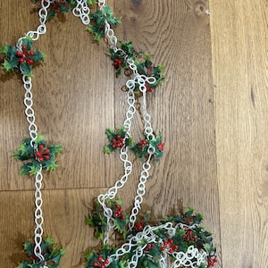 Mid century Christmas garland with Holly placed aprox every 6”. Total length is aprox 11 1/2 feet