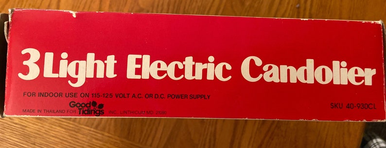 Three light electric candolier in box.