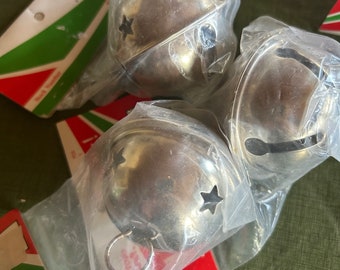 Vintage silver metal bells still in packages. The bell rings a nice jingle.Great for sleigh bells in the snow on horses! Selling in lot of 3