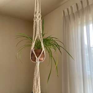 Vintage macrame off white plant pot holder.