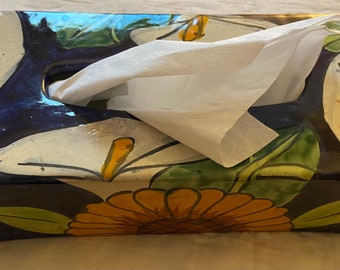 Floral Terre Cotta tissue dispenser vintage with lilies and sunflowers. Cobalt blue background