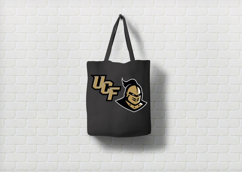 May include: Black canvas tote bag with a gold UCF logo and a knight's head graphic.