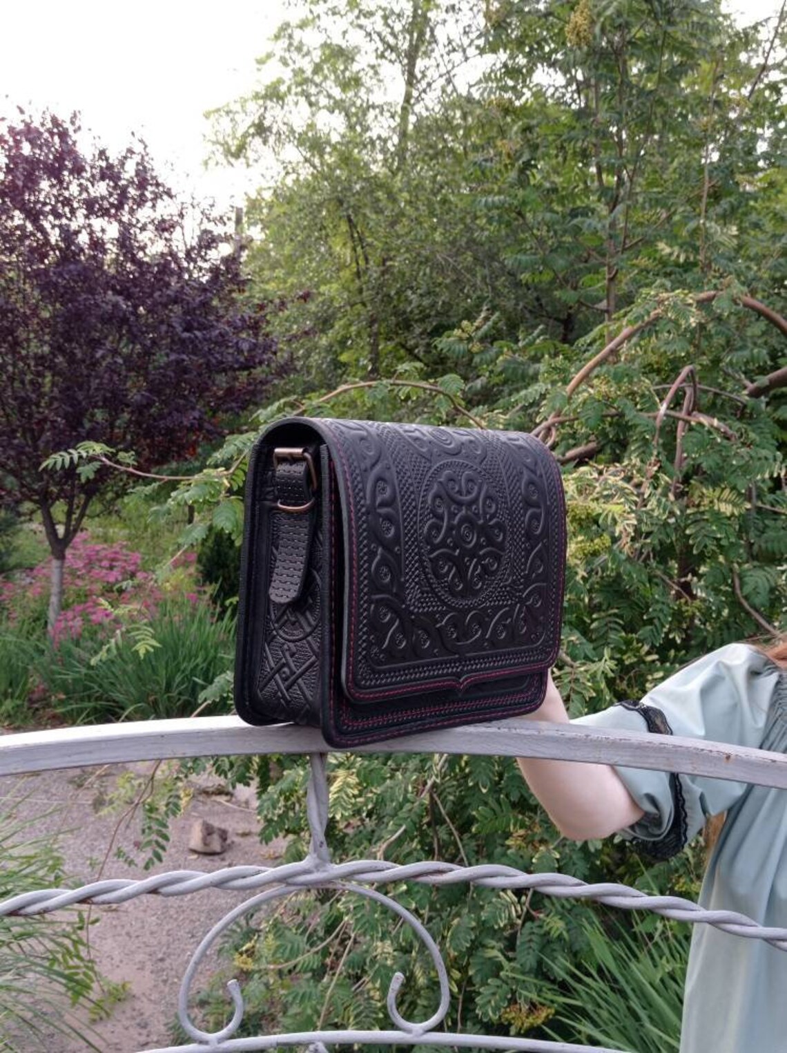 black tooled leather bag