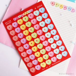 Hoja de pegatinas con letras de corazón y el mensaje "Amor de San Valentín" para diarios y agendas