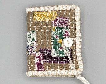 needle book, cover is slow stitched, four pages, two pockets