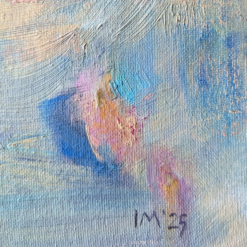 May include: Abstract oil painting with visible brushstrokes. The artwork features a blend of blues, pinks, and creams. The artist's initials "IM" and the year "23" are signed in the lower right corner. The painting has a textured appearance.