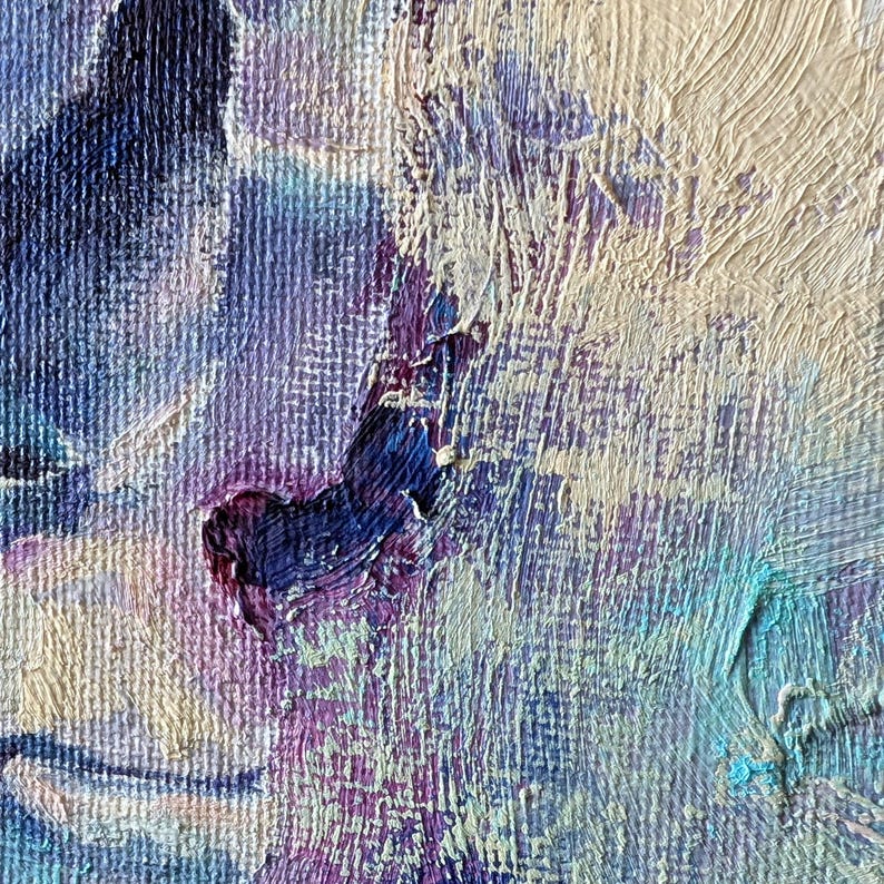 May include: Close-up of an abstract oil painting with textured brushstrokes. The artwork features a palette of blues, purples, and off-white, creating a sense of depth and movement. The painting's surface is heavily textured, with visible ridges and peaks.