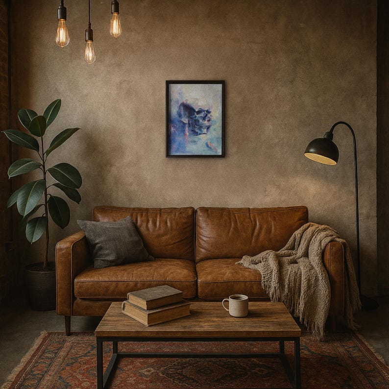 May include: A living room scene featuring a brown leather sofa, a wooden coffee table, and a framed abstract art piece. A floor lamp and a potted plant add to the decor. The artwork depicts a skull in shades of blue and purple.