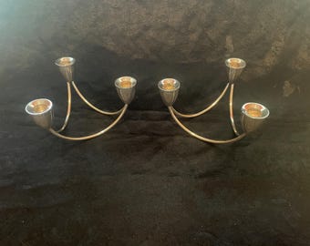 Duchin Creation – para potrójnych świeczników ze srebra próby 925. Są niezwykle eleganckie i ciężkie.