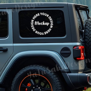 May include: A gray SUV with a spare tire on the back. The rear window features a white circular design that says "DESIGN HERE YOUR MOCKUP DESIGN HERE YOUR". The tires have orange accents.