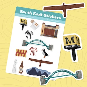 May include: A collection of North East Stickers with illustrations of local landmarks and symbols. Includes the Angel of the North, Tyne Bridge, a Metro sign, and a puffin. The text "North East Stickers" and "WHERESCLARE.CO.UK" are visible.
