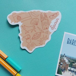 Peut inclure: Une silhouette brune de l'Espagne avec diverses illustrations, notamment un taureau, un b&acirc;timent, un &eacute;ventail et le mot "Espagne".