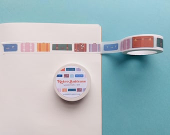 May include: A roll of white washi tape with a pattern of colorful retro suitcases. The tape is labeled "Retro Suitcase Washi Tape - 10m" and "www.heroclare.co.uk".