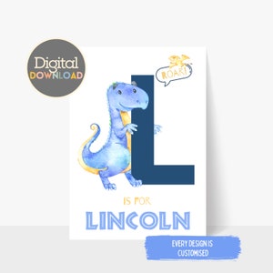 May include: A digital download print featuring a blue watercolor dinosaur next to a navy blue letter "L". The text "L is for Lincoln" is below the letter. A small yellow dinosaur says "ROAR!" in a speech bubble. The words "Digital Download" are in a circle.