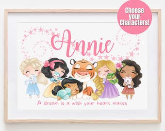 May include: A pink and white personalized print with the name "Annie" and a quote "A dream is a wish your heart makes". The print features cartoon characters from Disney movies, including Cinderella, Snow White, Jasmine, Rapunzel, and a tiger.