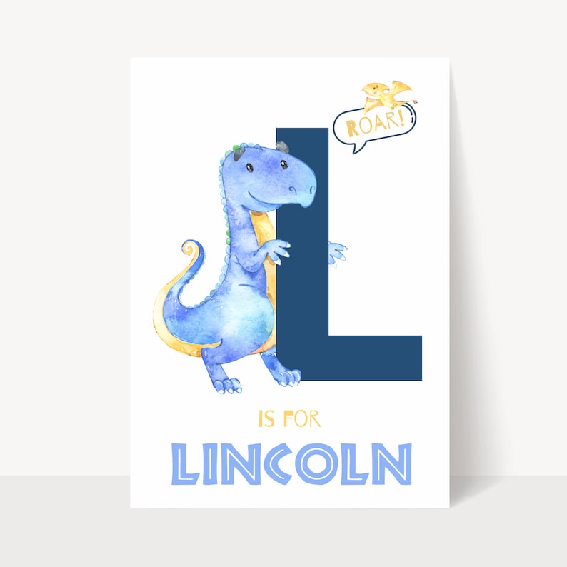 May include: A watercolor print featuring a blue dinosaur embracing a large navy blue letter "L". The text "IS FOR LINCOLN" is below the letter. A small yellow dinosaur with a speech bubble that says "ROAR!" is in the upper right corner.