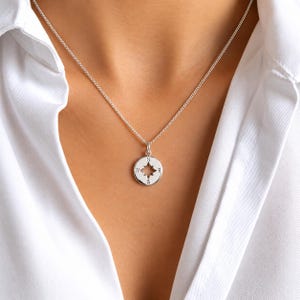 Sterlingzilveren kompasketting: minimalistische reissieraden