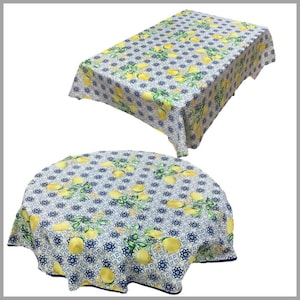 May include: Two tablecloths with a lemon and blue tile pattern. One tablecloth is rectangular and the other is round.