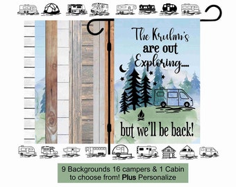 May include: A personalized garden flag with a watercolor background featuring a camper van, trees, and a campfire. The text reads "The Kruhm's are out Exploring... but we'll be back!"  There are 9 backgrounds, 16 campers, and 1 cabin to choose from.