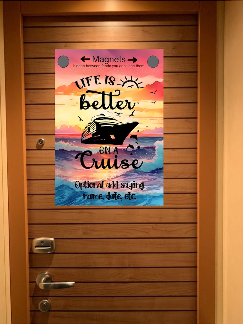 Cruise door with a wooden panel design. A colorful sign is attached to the door with the text 'Life is better on a Cruise' and 'Optional add saying name, date, etc.' The sign has a sunset background with a cruise ship and dolphins. The sign also has the text 'Magnets' and 'hidden between fabric you don't see them'.