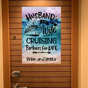May include: A blue and white cruise ship with the text "Husband and Wife Cruising Partners for Life Brian and Krista" on a blue and white background with glitter.