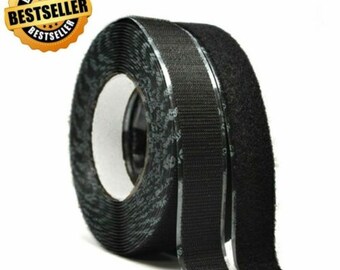 May include: Two rolls of black hook and loop tape. One roll is a hook side and the other is a loop side. Both rolls are on a white background.