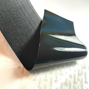 May include: Black hook and loop tape with adhesive backing. The tape is folded to show the adhesive side.