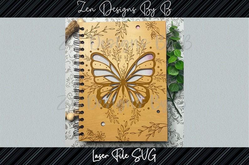 Close-up of detailed butterfly engraving on wood, symmetrical filigree frame, butterfly notebook cover SVG in bundle