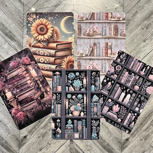 May include: Set of five illustrated cards featuring different designs of bookshelves with books, flowers, and candles. The cards are printed on a dark background with a subtle texture.