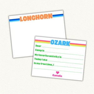 May include: Two blank note cards with colorful stripes and text. The top card says "LONGHORN" in blue and orange letters. The bottom card says "OZARK" in blue and yellow letters. The bottom card has lines for writing and says "Dear", "Camp is", "My favorite activity is", "Today I ate", "In my free time, I", and "Camelia" with a pink heart.