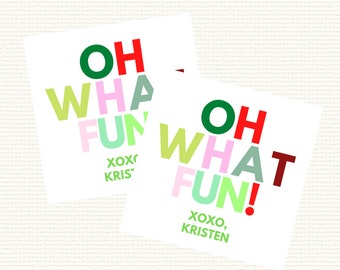 May include: Two white cards with the text "Oh What Fun!" in colorful letters. The first card has the text "XOXO, KRIS" at the bottom. The second card has the text "XOXO, KRISTEN" at the bottom.