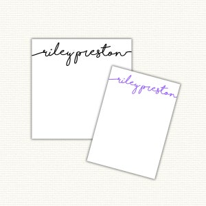 May include: Two blank notepads with the name "riley preston" written in cursive at the top. The name is black on one notepad and purple on the other.