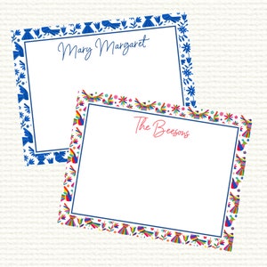 May include: Two personalized stationery cards. One card has a blue floral and bird border with the name "Mary Margaret" in blue script. The other card has a colorful bird and floral border with the name "The Beesons" in red script.