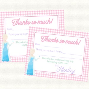May include: Two pink and white gingham thank you cards with a watercolor illustration of a princess in a blue dress. The text on the cards reads "Thanks so much!" and includes space to write a personalized message.