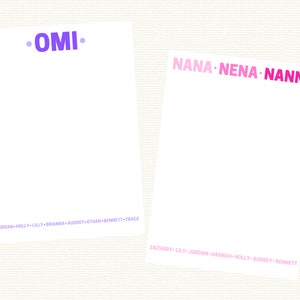 May include: Two white notepads with purple and pink text. The top notepad has the text "•OMI•" in purple. The bottom notepad has the text "NANA NENA NANNY" in pink. The bottom of each notepad has a list of names in purple and pink text.