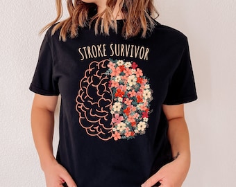 May include: Black t-shirt with the text "STROKE SURVIVOR" and a graphic of a brain with one half filled with flowers.
