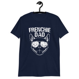 May include: Navy blue t-shirt with a white graphic of a French Bulldog wearing sunglasses and the text "Frenchie Dad".
