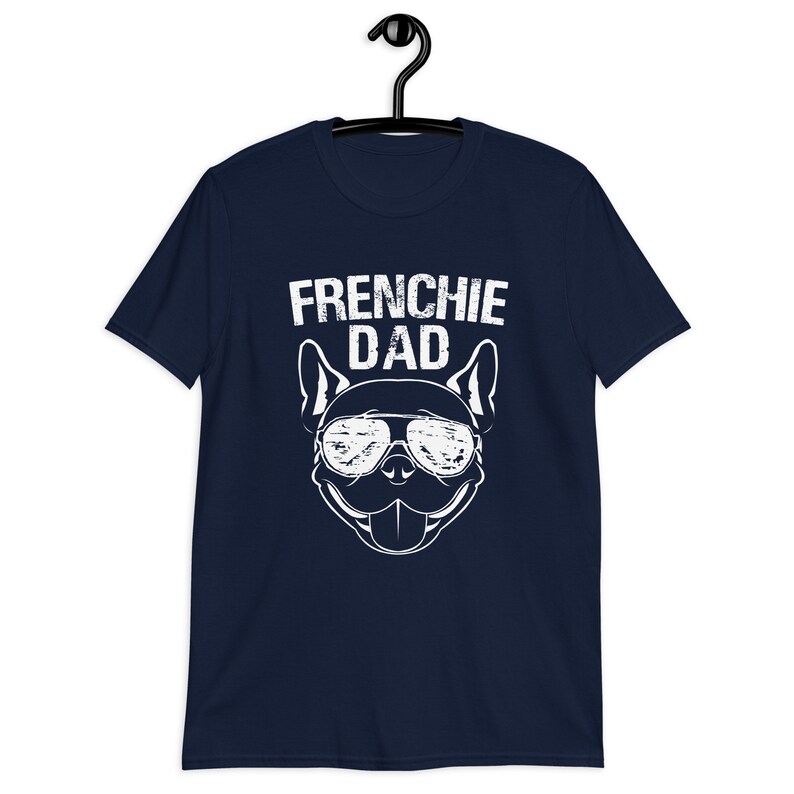 May include: Navy blue t-shirt with a white graphic of a French Bulldog wearing sunglasses and the text "Frenchie Dad".