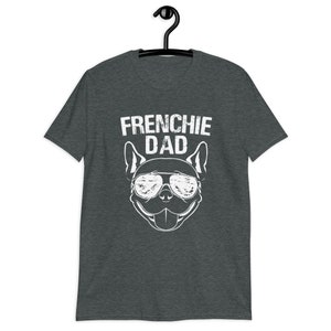 May include: A dark heather grey t-shirt with a white graphic of a French Bulldog wearing sunglasses and the text "Frenchie Dad".