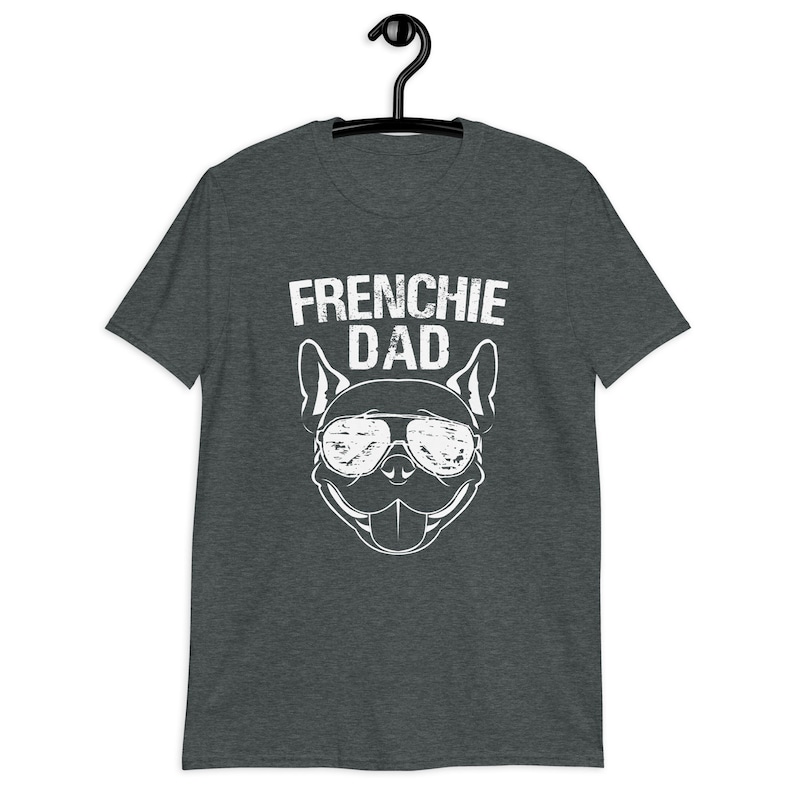May include: A dark heather grey t-shirt with a white graphic of a French Bulldog wearing sunglasses and the text "Frenchie Dad".
