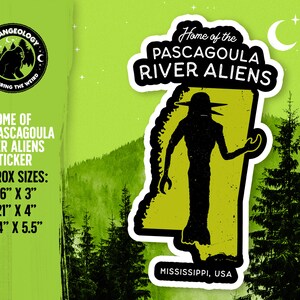 May include: A green and black sticker with the text "Home of the Pascagoula River Aliens" and a silhouette of a creature with large eyes and a pointed head. The sticker is shaped like the state of Mississippi and has the text "Mississippi, USA" at the bottom.