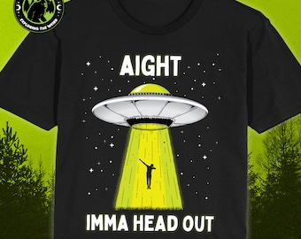 May include: Black t-shirt with a graphic of a UFO with a person doing a dab pose underneath. The text "AIGHT IMMA HEAD OUT" is printed below the UFO.