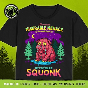 May include: Black t-shirt featuring a pink, crying Squonk creature illustration. The design includes text that reads "Beware the Miserable Menace of the hemlock forests" and "Cry it out for the Squonk."